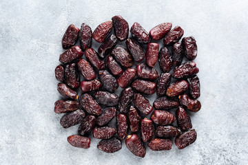 Wall Mural - Dried dates on concrete background. Date fruit