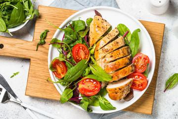 Poster - Chicken fillet with salad top view.