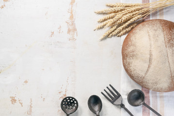 Wall Mural - Fresh bread on the rustic white table flat lay background with copy space.