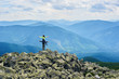 © anatoliy_gleb - Back view of couple posing, woman sitting on shoulders of man, beautiful mountains scenery on background. Tourists reaching peak together. Wild nature with amazing views. Sport tourism.