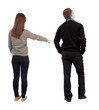 © ghoststone - Back view of couple in sweater with mobile phone.
