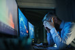 © Halfpoint - Frustrated businessman with computer sitting at desk, working late. Financial crisis concept.