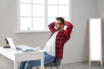 Sticker - Young man with laptop working at home