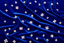 Lilac Petals Are Scattered On Blue Velvet Like Stars