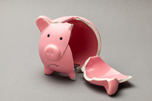 Broken Piggy Bank On Gray Background