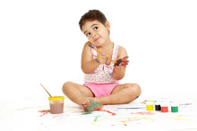 Nice Young Girl Draws Painting While Sitting On The Floor
