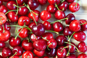 Wall Mural - Ripe red cherry heap background close up