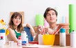 © Elnur - Couple decorating pots in workshop during class
