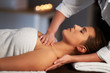 © Kalim - Relaxed woman receiving back massage