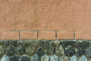 Painted bricks and stones wall. Two textures background. Old wall.