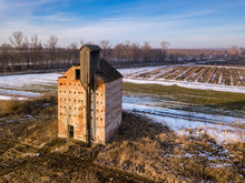 Abandoned Ruins Of A Granary In The Middle Of A Field