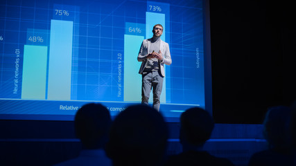 Aufkleber - On-Stage: Speaker Does Presentation of the New Electronic Product, Shows Infographics, Statistic Animation on Screen. Auditorium Hall Live Event, Start-up Conference, Device Presentation and Release