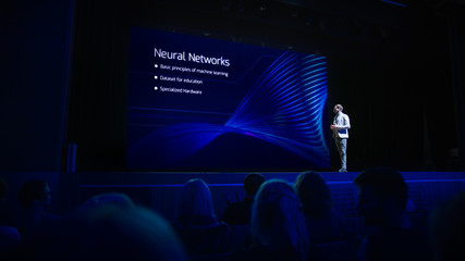 Computer Science Startup Conference: On Stage Speaker Does Presentation of New Product, Talks about Neural Networks, Shows New AI, Big Data and Machine Learning App on Big Screen. Live Event