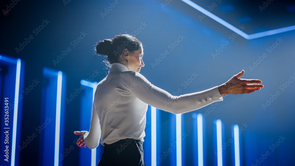 Female Motivational Speaker on Stage, Talking about Happiness, Diversity, Success, Leadership, STEM and How to Be Productive. Woman Presenter Leads Tech Business Conference. Low Angle Shot - obrazy, fototapety, plakaty 