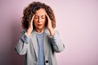 Middle age beautiful businesswoman wearing elegant jacket over isolated pink background with hand on head for pain in head because stress. Suffering migraine.