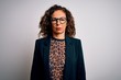 © Krakenimages.com - Middle age brunette business woman wearing glasses standing over isolated white background depressed and worry for distress, crying angry and afraid. Sad expression.