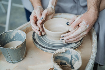 Potter's wheel, pottery workshop, working with clay, clay, clay modeling, modeling, ceramics, hands made of clay, clay pot, stained in clay, dirty hands, creativity, workshop, hands, planters