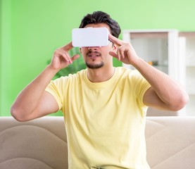 Young man with virtual reality goggles