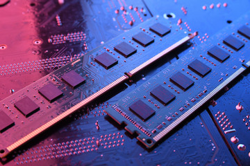Computer memory RAM on motherboard background . Close up. system, main memory, random access memory, onboard, computer detail. Computer components . DDR3. DDR4. DDR5