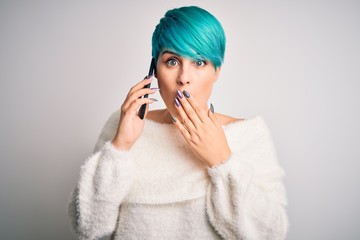 Sticker - Young woman with blue fashion hair having a conversation talking on smartphone cover mouth with hand shocked with shame for mistake, expression of fear, scared in silence, secret concept