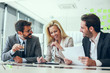 © Sanja - Shot of a group of businesspeople sitting together in a meeting