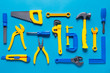 © loki_ast - Toys background. Top view of toy tools on blue background