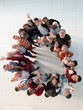 © ASDF - international group of happy people standing in a circle.