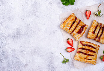 Sweet puff pastry cakes with strawberry