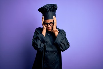 Canvas Print - Young african american chef girl wearing cooker uniform and hat over purple background suffering from headache desperate and stressed because pain and migraine. Hands on head.