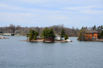 Wall Mural - One Island in Thousand Islands Region in fall of New York State, USA