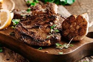 Wall Mural - Rib eye steak with herbs and garlic