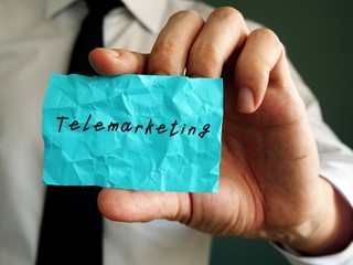Business concept meaning Telemarketing with phrase on the piece of paper.