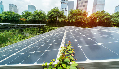 Wall Mural - ecological energy renewable solar panel plant with urban landscape landmarks