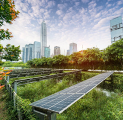 Wall Mural - ecological energy renewable solar panel plant with urban landscape landmarks