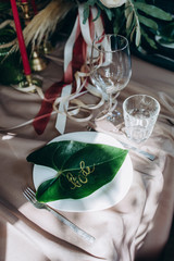 Wedding table decoration. Glasses and candles.