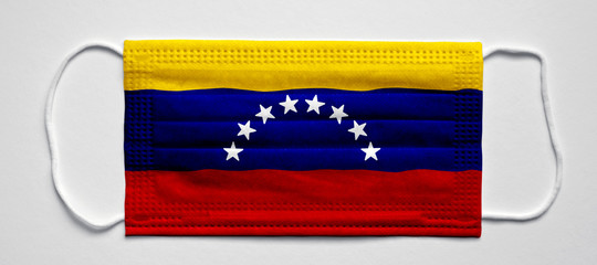 Venezuela flag. Medical mask, Medical protective mask on a white background.Healthcare and medical concept.