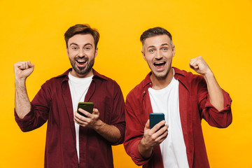 Wall Mural - Two attractive young men friends wearing casual clothes