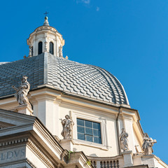 A fragment of the cathedral with statues of saints on the dome. Rome. Italy