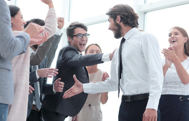 Wall Mural - corporate group of employees congratulating each other on the victory