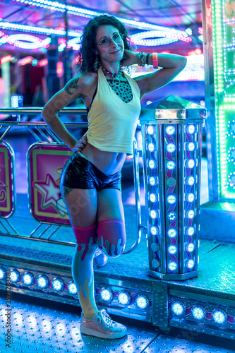 Cuadros en Lienzo a young woman in eighties clothes with curly hair posing in different attraction