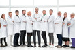 © ASDF - tight-knit group of medical center doctors standing together.