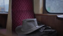 Zoom Out From Hat And Coat On The Seat Of A Vintage Train Carriage