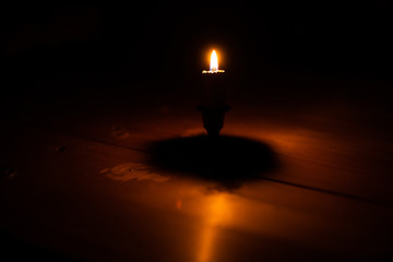 burning candle in the dark