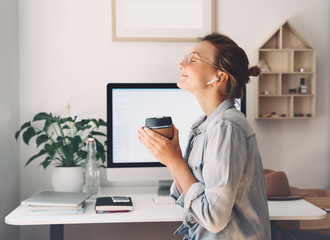 Woman freelancer indoors home office concept.