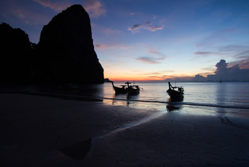 Canvas Print - Sunset with longtail boat silhouette in Railay beach, Krabi - Thailand