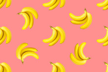 Seamless Pattern From Bundles Of Ripe Yellow Bananas On Pink Background. Tropical Summer Fruits Concept. Template For Wallpaper Textile Print Product Surface Design