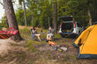 © phpetrunina14 - couple sitting in portable chairs drinking tea talking. camping summer activities