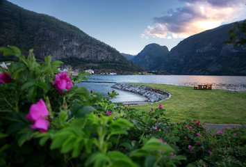 Wall Mural - A small town in Norway surrounded by fjords at sunset, a beautiful summer landscape, a popular travel destination