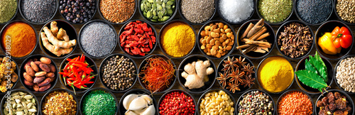Papel de parede Colourful background from various herbs and spices for cooking in bowls