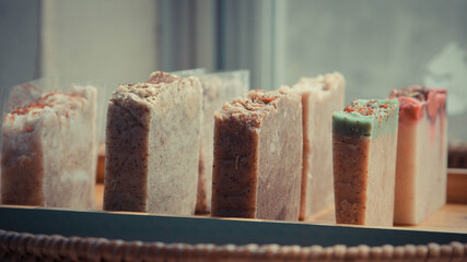 Wall Mural - Side view of cake slices on wooden tray